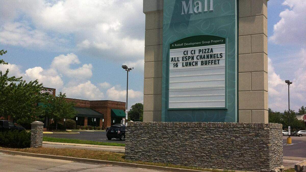 The sign outside Turfland Mall still advertises Cici's Pizza, which closed in April. Pat Walter, one of franchisees, said the no effort was made to develop the mall, and boarded-up windows and graffiti began to proliferate.  
