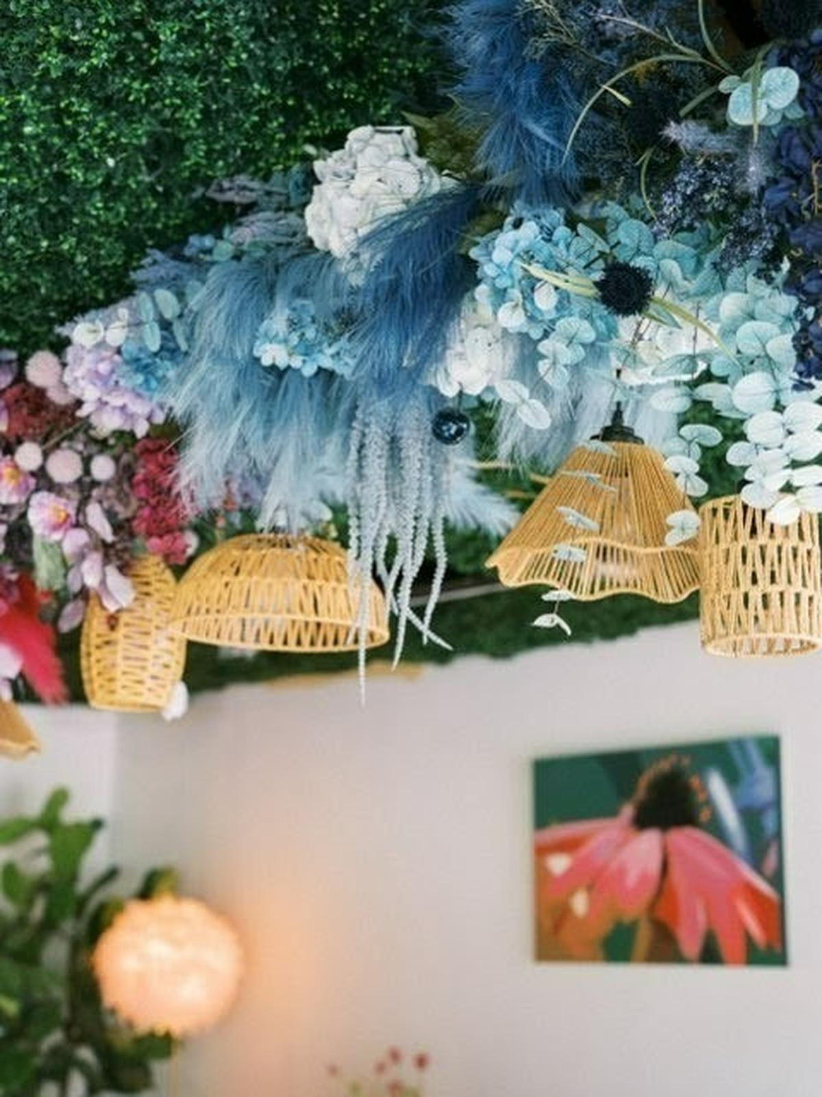 Poppy’s Flower Bar, opening on Old Mt. Tabor Rd., will have locally grown flowers that you can arrange or just purchase in ready-made bouquets while you sip on botanical cocktails or wine. Shown here are flowers on the ceiling.