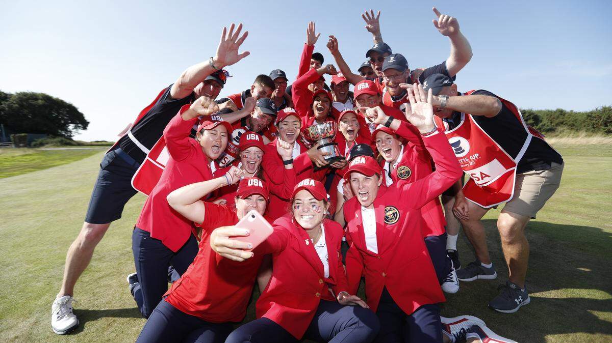 The American squad, including Kentucky golfer Jensen Castle in the foreground with her phone, celebrated after winning the Curtis Cup on Saturday.