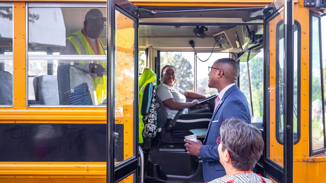 Fayette County Public Schools Superintendent Demetrus Liggins and Lexington Mayor Linda Gorton and speak to bus driver Rodrica Lyvers and Ullysses Liggins on the first day of school at Northern Elementary School in Lexington, Ky., on Wednesday, Aug. 16, 2023.