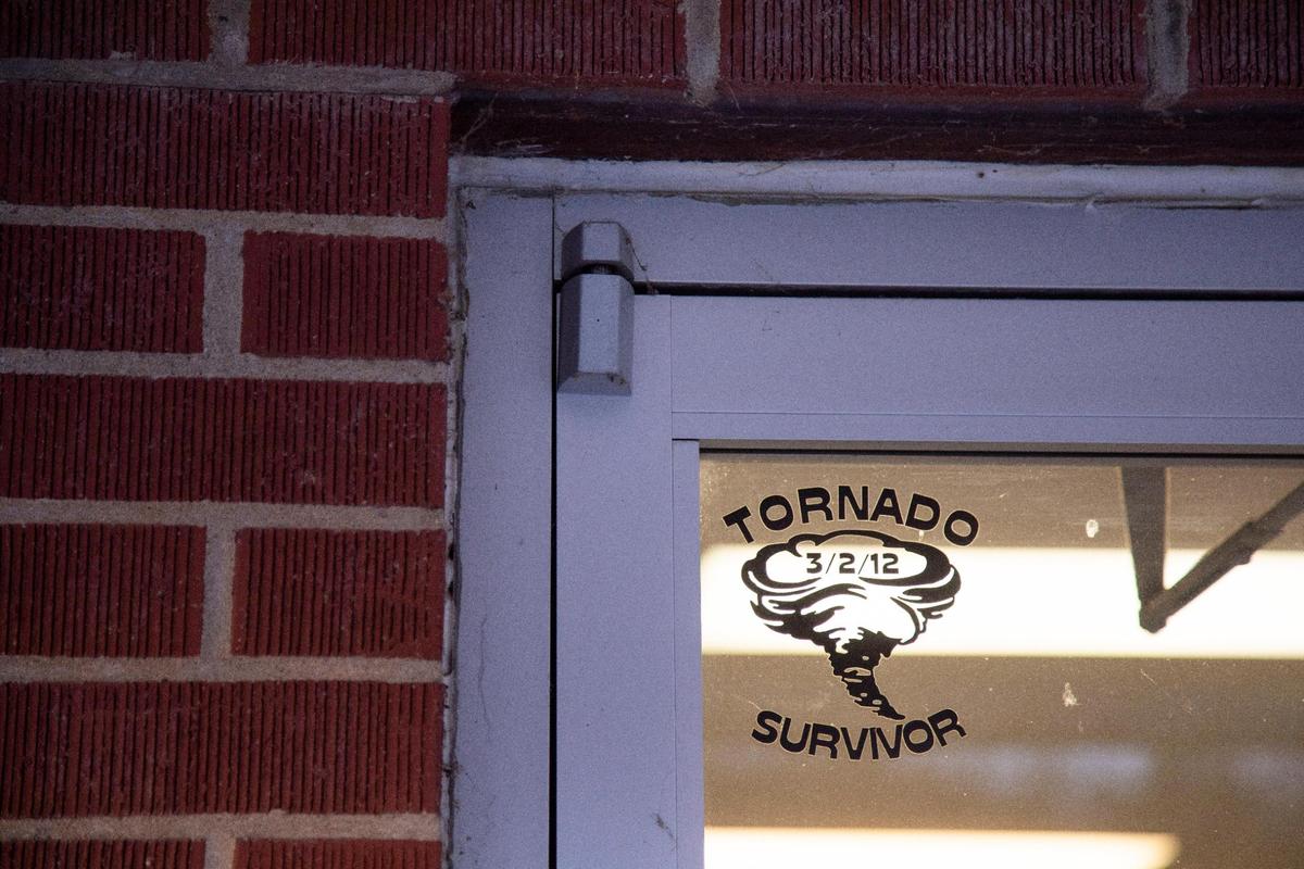 A Tornado Survivor sticker in the top corner of Birddog’s Shirts-N-More in West Liberty, Ky., Wednesday, December 15, 2021. BirddogÕs Shirts-N-More decided to rebuild after the tornado destroyed their building.