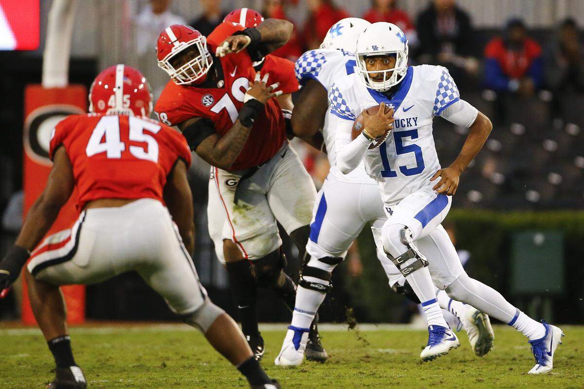 The Cats and quarterback Stephen Johnson went all white at Georgia last year with a special touch of removing the usual blue stripe atop the helmet.