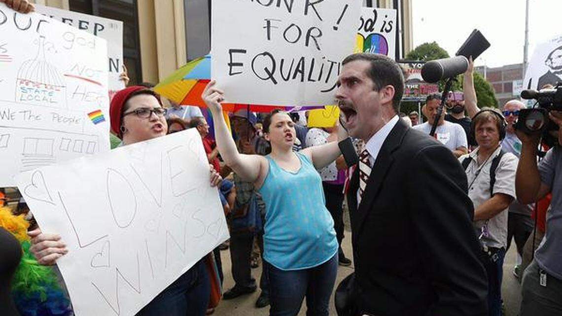Jeffrey Shook preached to the crowd outside the U.S. Courthouse as the hearing for Kim Davis took place inside. Photo by Charles Bertram | Staff