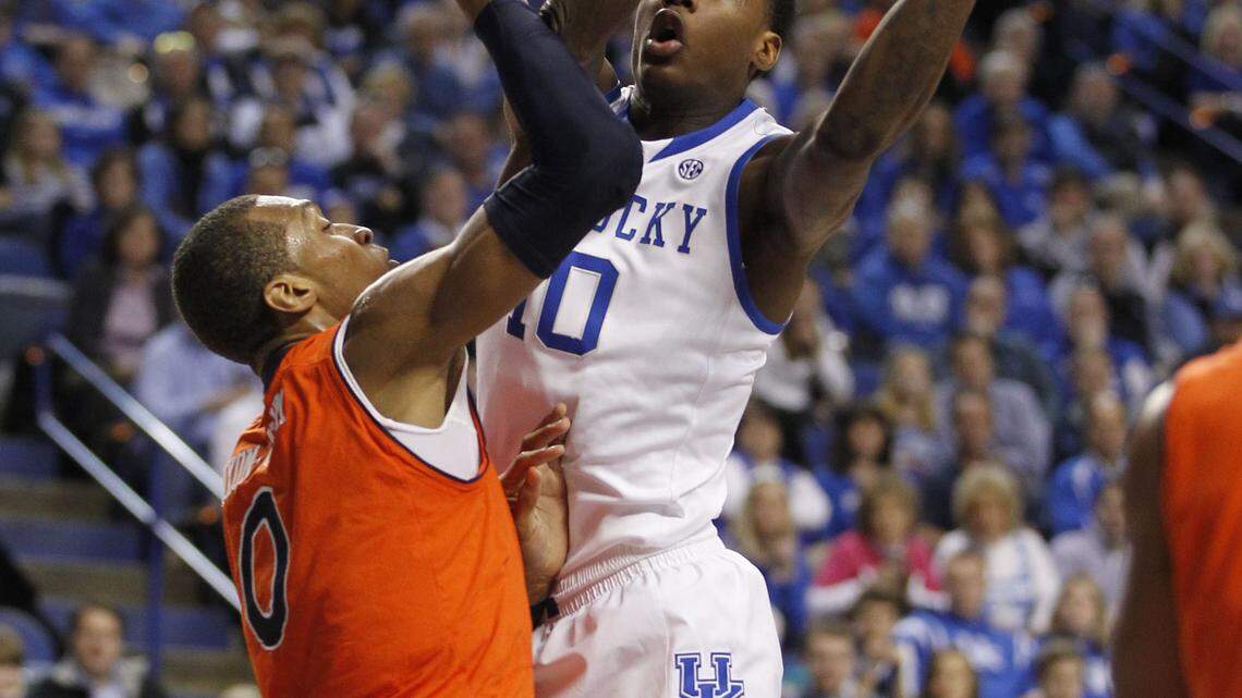 Kentucky guard Archie Goodwin cored over Auburn center Asauhn Dixon-Tatum on Saturday.  Photo by Mark Cornelison | Staff