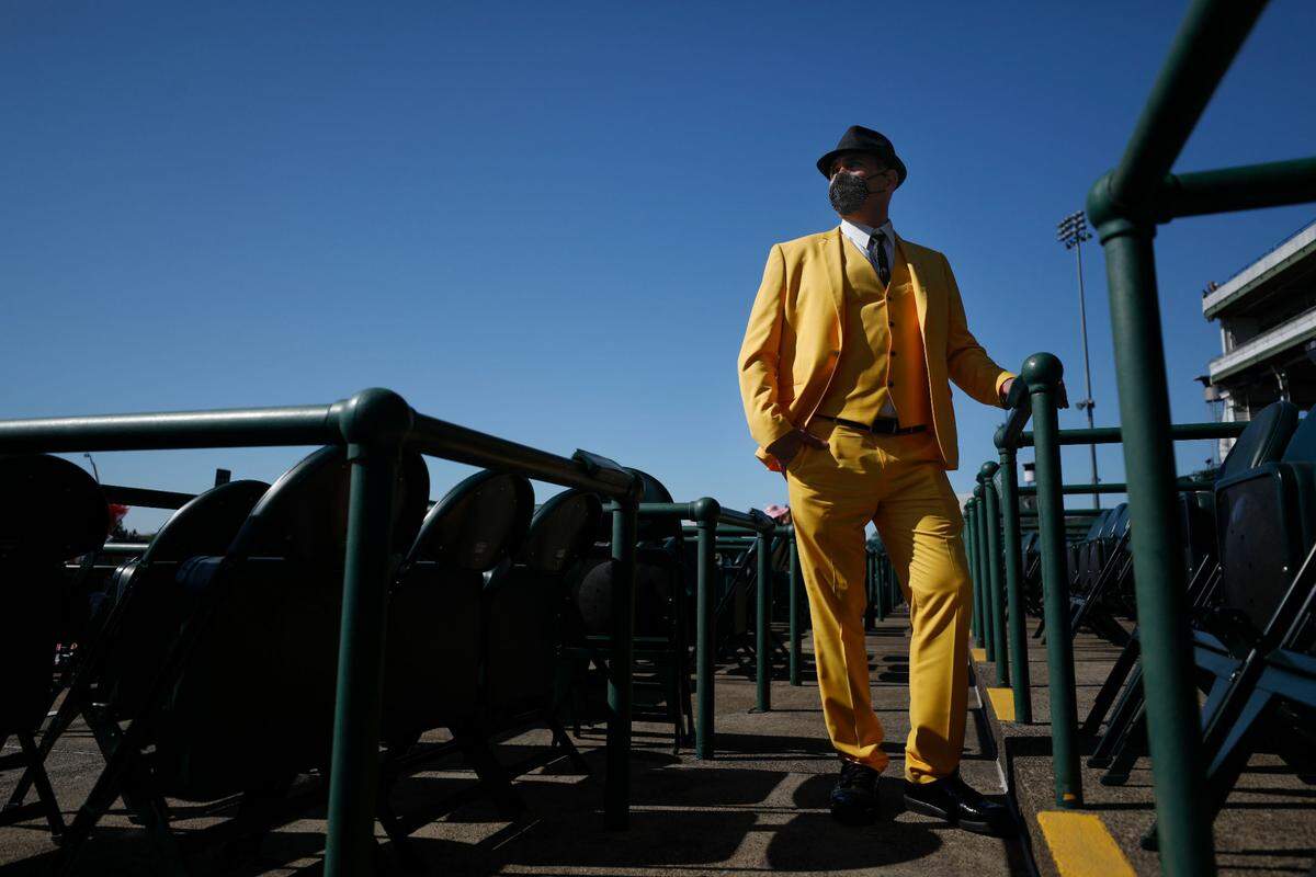 Michael Dandaneau wears a yellow suit he purchased on Amazon at Churchill Downs in Louisville, Ky., Saturday, May 1, 2021.
