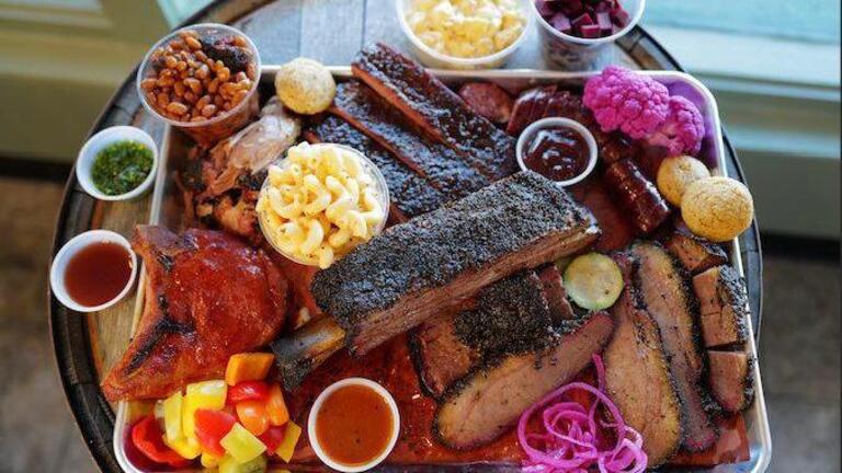Texas-style craft barbecue restaurant opening in former Blue Door location. See inside