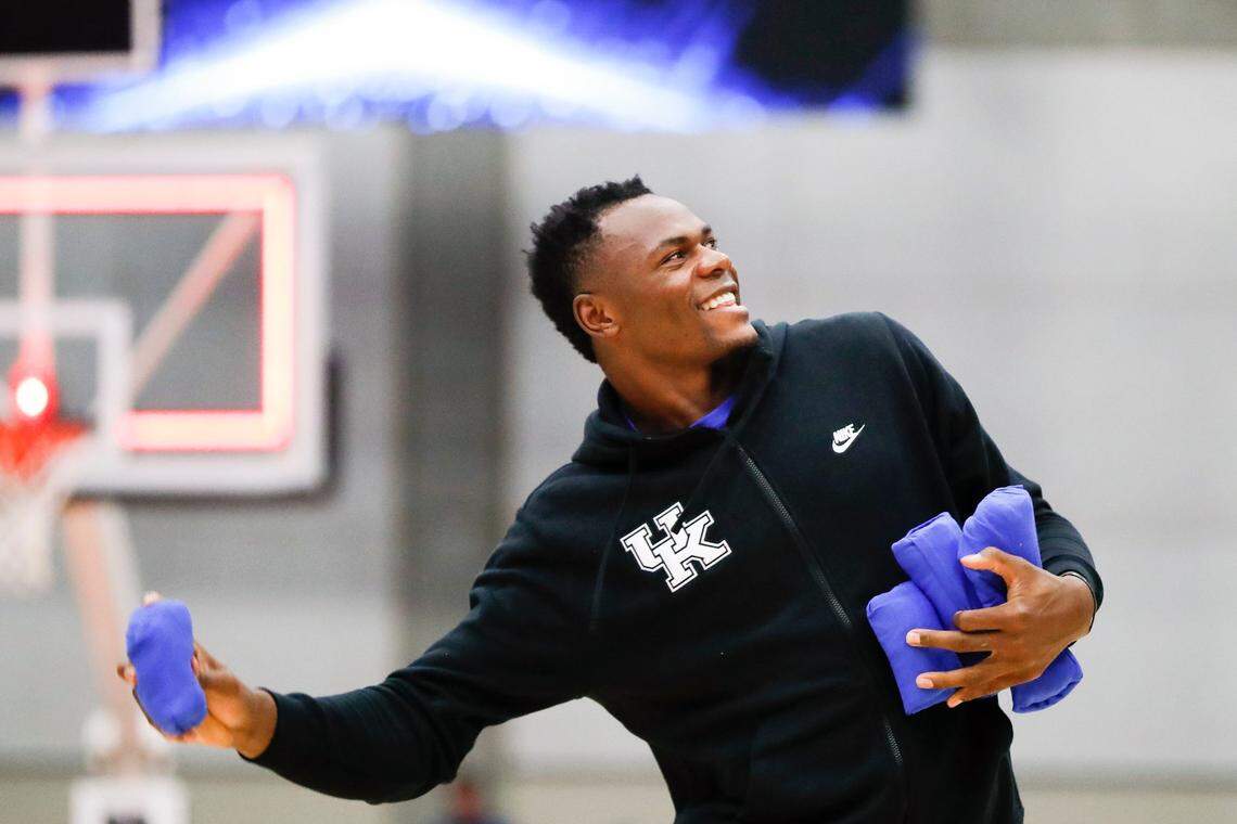 Kentucky’s Oscar Tshiebwe throws T-shirts to the crowd gathered for the Blue-White Game at Appalachian Wireless Arena in Pikeville on Saturday.