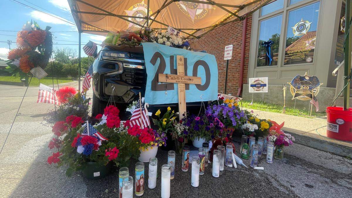 The cruiser of deputy Caleb Conley sits decorated outside of the Scott County Sheriff’s Office. Conley was killed one week ago during a traffic stop.