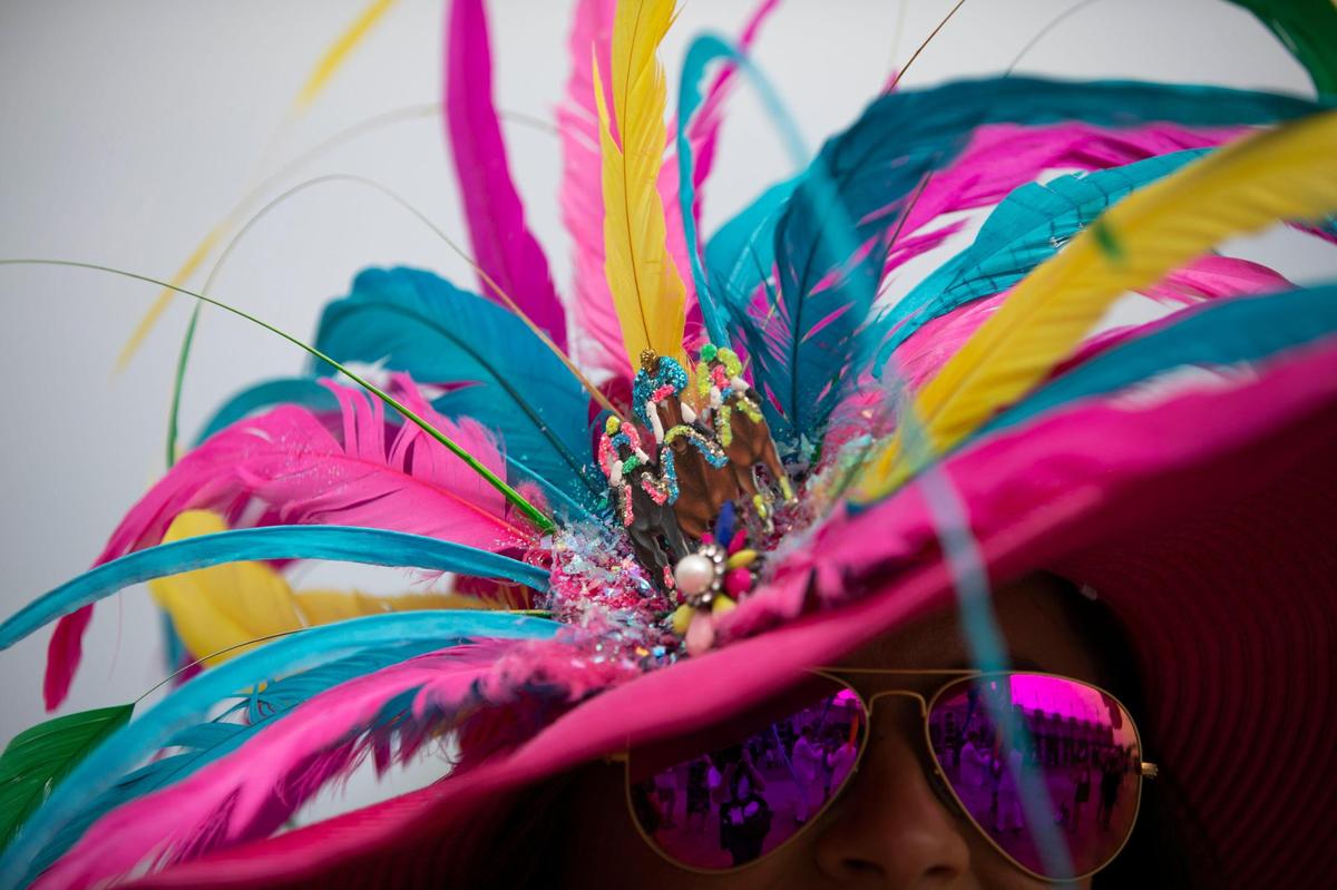 Amanda Ahlfeld’s hat for the Kentucky Derby, from Lee’s Design, is accented with race horses at Churchill Downs in Louisville, Ky., Saturday, May 6, 2023.