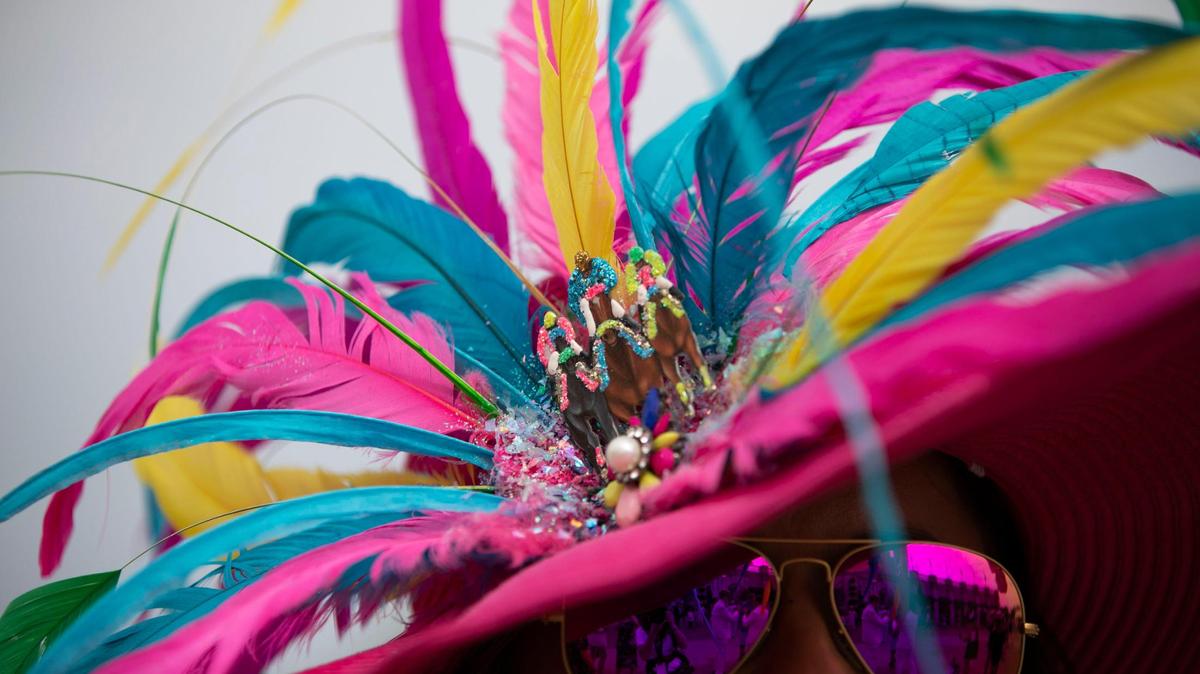 Amanda Ahlfeld’s hat for the Kentucky Derby, from Lee’s Design, is accented with race horses at Churchill Downs in Louisville, Ky., Saturday, May 6, 2023.