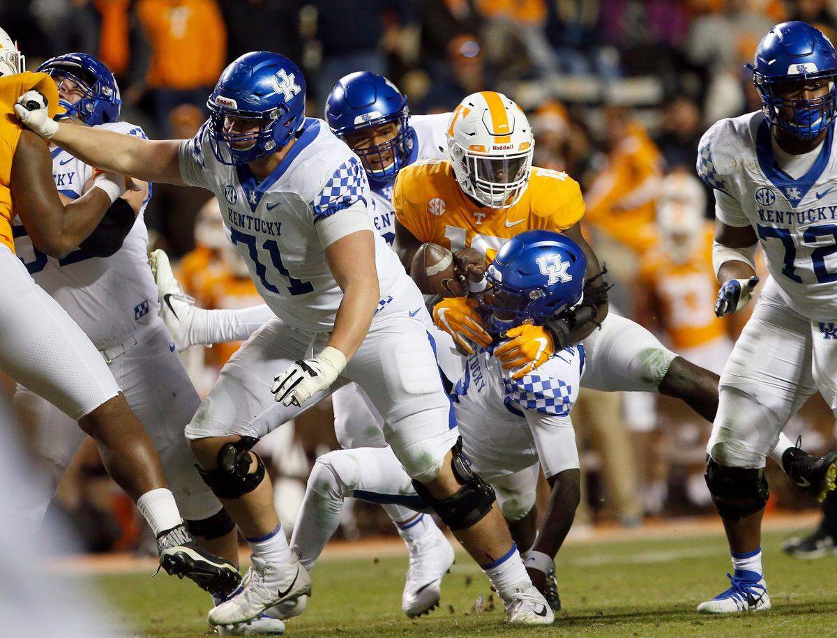 Tennessee linebacker Darrell Taylor (19) forced a Terry Wilson fumble while recording one of the four quarterback sacks he made in UT’s 24-7 upset of No. 12 UK last season at Neyland Stadium.