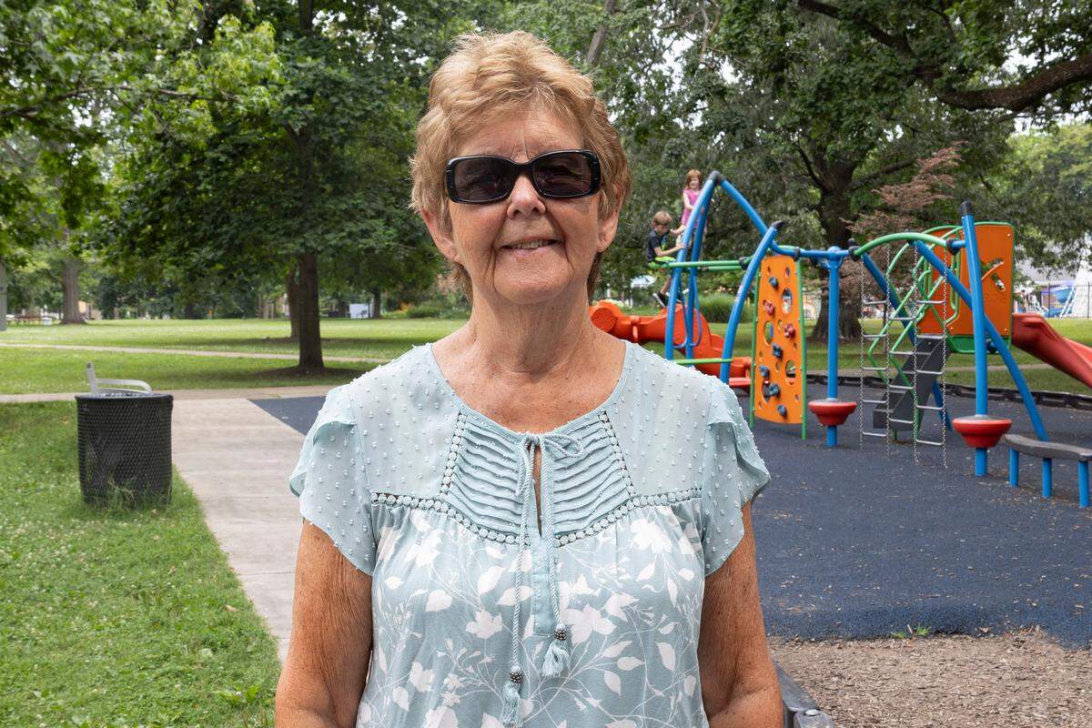 Karen Zimmerman, a 72-year-old Portland, Oregon resident poses for a photo in Woodland Park in Lexington, Kentucky on June 19, 2024.