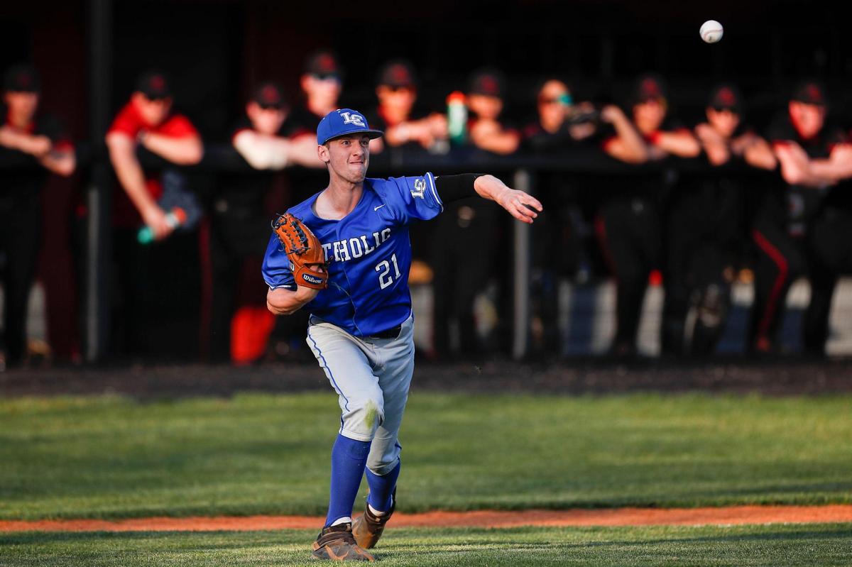 Lexington Catholic pitcher Matthew Poe throws out a Paul Laurence Dunbar runner attempting to reach base on a bunt Wednesday night. Poe, a senior, struck out eight for the Knights.