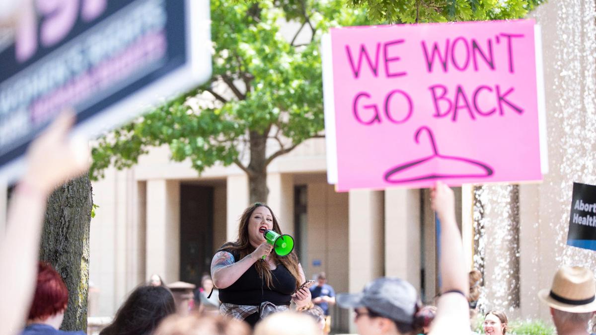 Julia Blake leads chants during the Rise Up 4 Abortion Rights protest in downtown Lexington, Ky., Saturday, May 14, 2022.