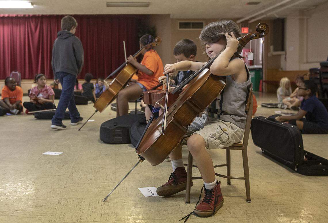 Jacob Laver plays the cello during a MusicWorks class at Arlington Christian Church in Lexington, Ky., Tuesday, Sept. 17, 2019.