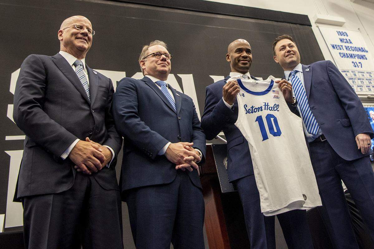 Kevin Marino, chair of the Seton Hall University Board of Regents, from left, Seton Hall President Joseph E. Nyre, and SHU Athletic Director Bryan Felt, welcome Shaheen Holloway, second right, as the Pirates’ new men’s basketball head coach.