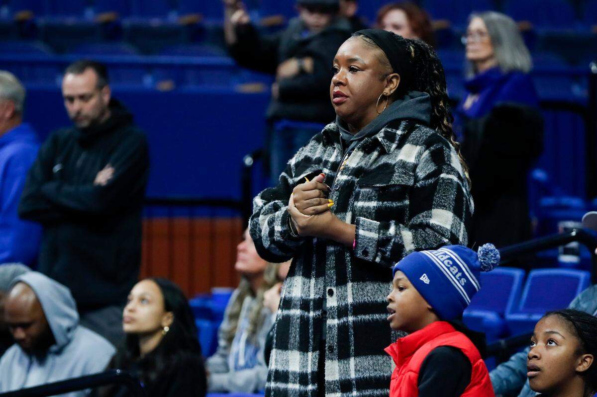 Ebony Twiggs, mother of Kentucky freshman Justin Edwards, watches her son play for the Wildcats during an exhibition game against Kentucky State on Nov. 3.