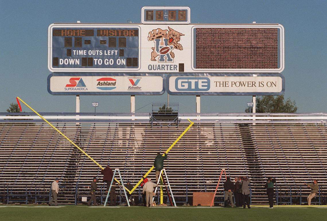 University of Kentucky employees install one of the two new goal posts at Commonwealth Stadium in the days after the Wildcats upset Alabama in 1997. The two new posts replaced the ones fans destroyed storming the field in celebration.