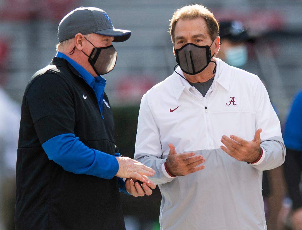 Under Mark Stoops, left, Kentucky is 0-3 vs. Alabama and Crimson Tide head man Nick Saban, right. The Wildcats have been outscored 145-16 combined in those three games.