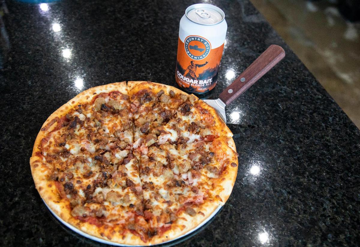 A meat pizza from Rickhouse Pub, which offers many options for food and drink from burgers, sandwiches, and desserts such as fried cookie dough balls, deep-fried Oreos and funnel cakes.