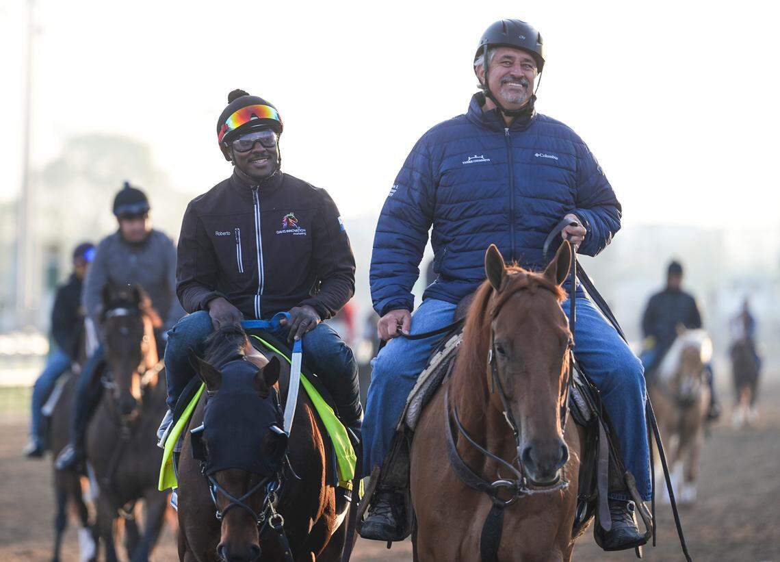 Trainer Steve Asmussen, right, help leads Kentucky Derby 151 contender Publisher after a workout at Churchill Downs in Louisville, Kentucky on Tuesday, April 22, 2025.
