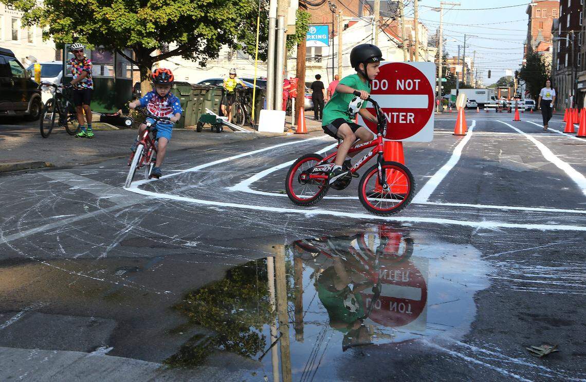 Reflection in a puddle while riding the Kids Rodeo bike course Saturday during Bike Lexington Saturday, Sept. 28, 2019.