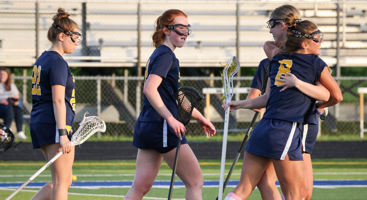 Sayre’s Anna Mullikin (8) congratulates Emeline Offit after she scored the final goal against Henry Clay on Wednesday.