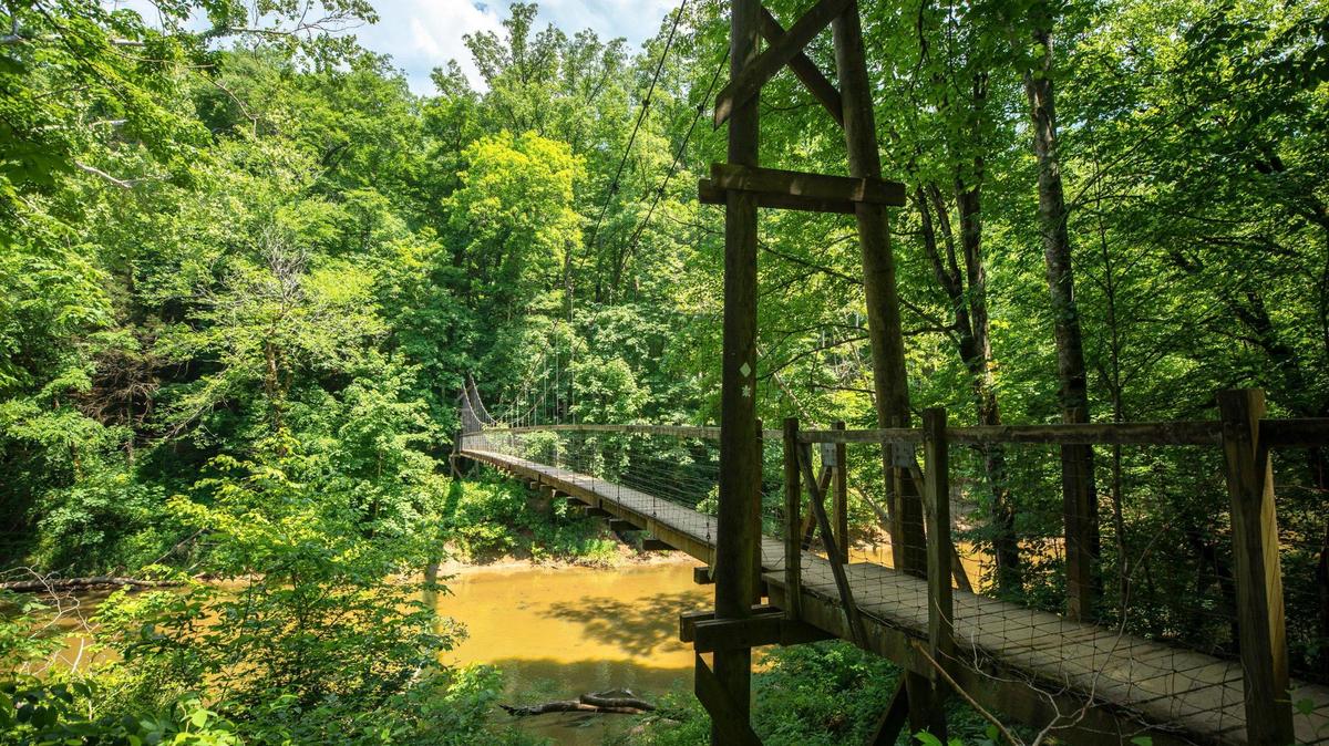 The Sheltowee Trace Suspension Bridge crosses the Red River in the Daniel Boone National Forest near Slade, Ky., Monday, May 30, 2022