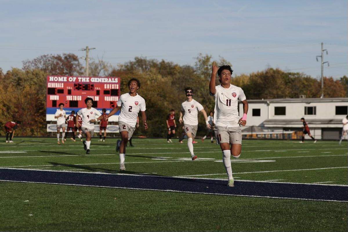 Lafayette’s Alecx Castro (11) approaches the Generals cheering section after his free kick goal in the second half of Wednesday’s state semifinal gave the Generals the lead for good.