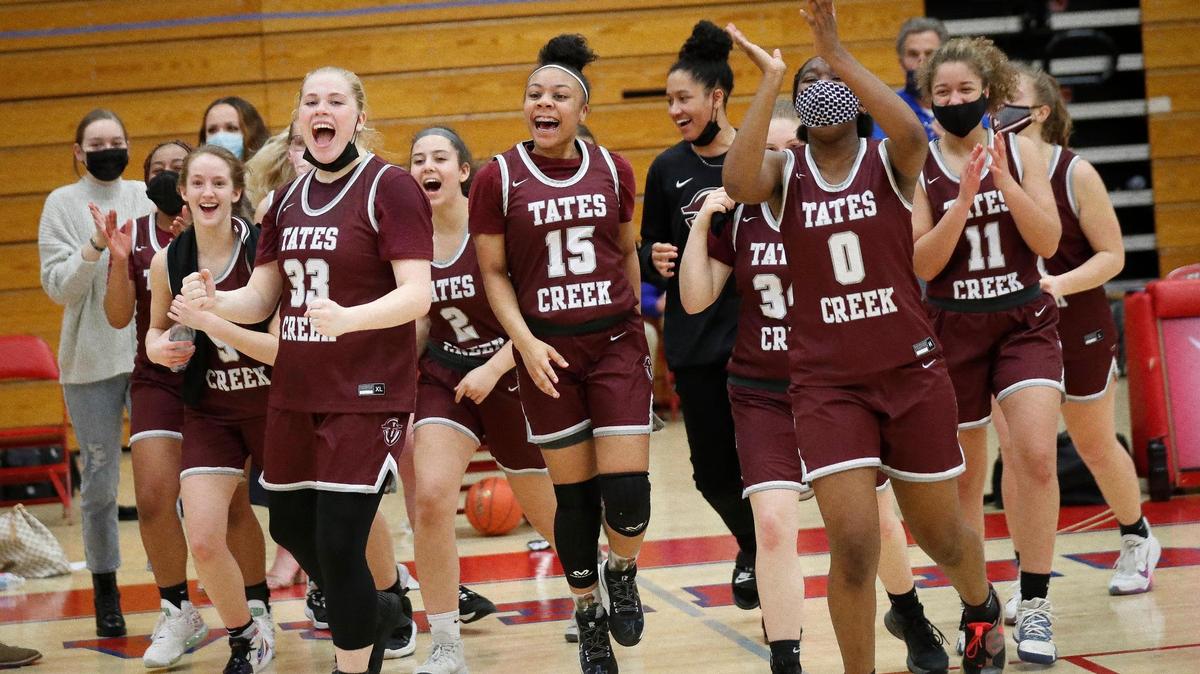 Tates Creek celebrates after defeating Lafayette 64-60 in overtime during the 43rd District Tournament championship at Lafayette High School last week.