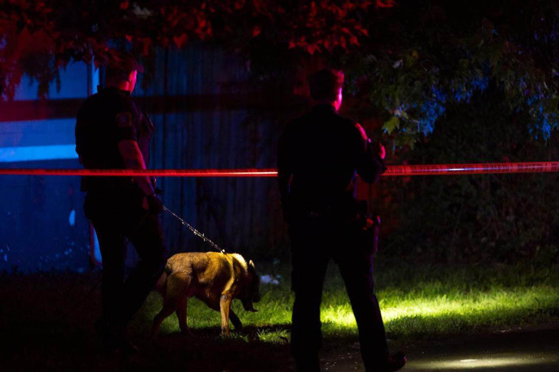Police officers investigate the area of a reported shooting on Idaho Avenue near Dakota Street in Lexington, Ky, Friday, May 17, 2024.