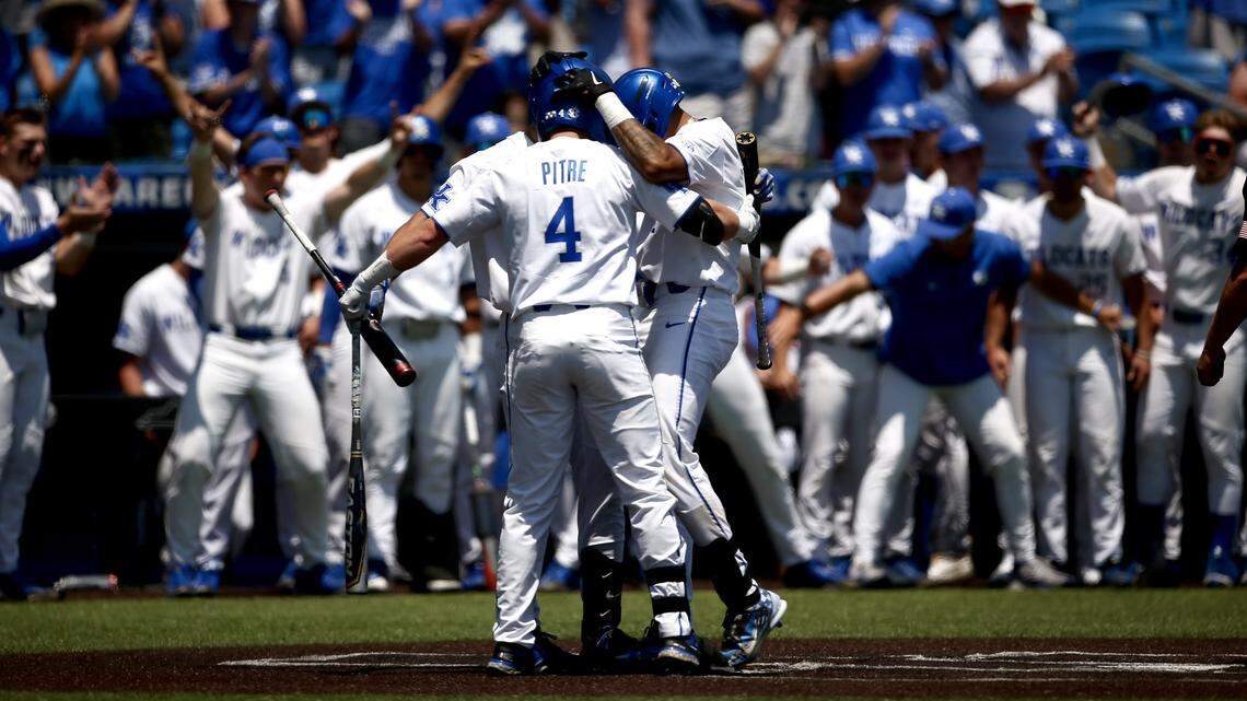 Devin Burkes was greeted by teammates at home plate after hitting a solo home run in the fourth inning that put Kentucky ahead for good at Kentucky Proud Park on Friday.