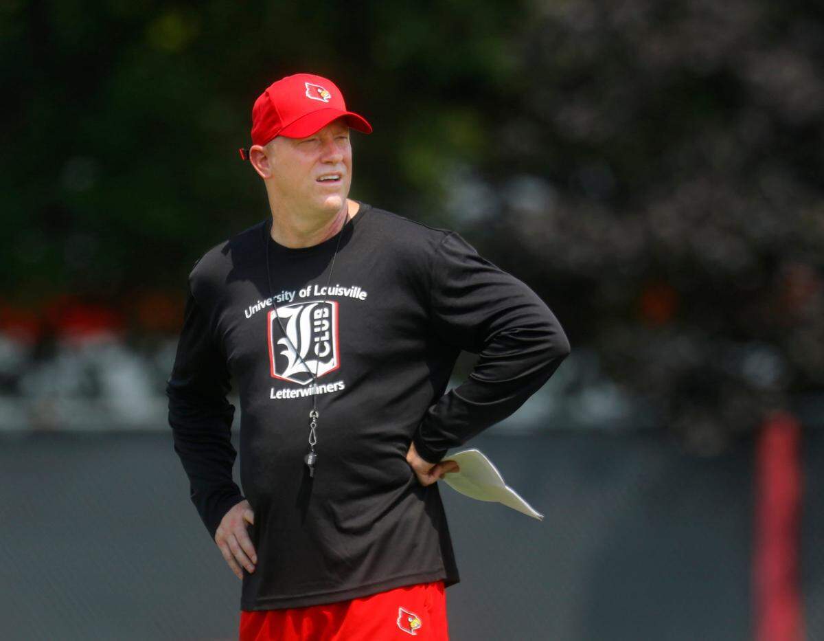 Louisville’s Jeff Brohm coaches during a Cardinal practice on August 1, 2023. (USA Today Network)