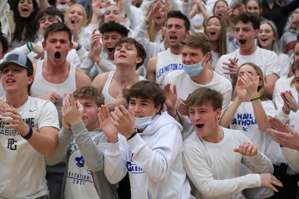 Lexington Catholic’s student section roared their approval of a play during the Knights’ 61-56 win over Paul Laurence Dunbar.