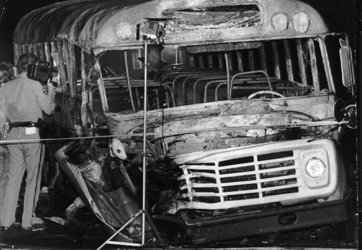 In this May 1988 photo, Kentucky state police inspect the bus following crash in Carrollton, Ky. Twenty-four children and three adults heading home from the church trip died in the nation’s worst alcohol-related highway catastrophe. It happened on May 14, 1988, along a rural stretch of Interstate 71 near Carrollton, Ky., situated between Louisville and Cincinnati.