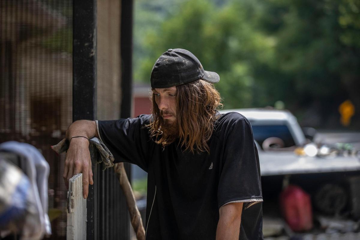 Aaron James Campbell, along with family members, had to be rescued from the roof of their mobile home by helicopter during flooding last month. He is staying with Jack and Sherry Alsept in Perry County, Ky., and helping them clean up.