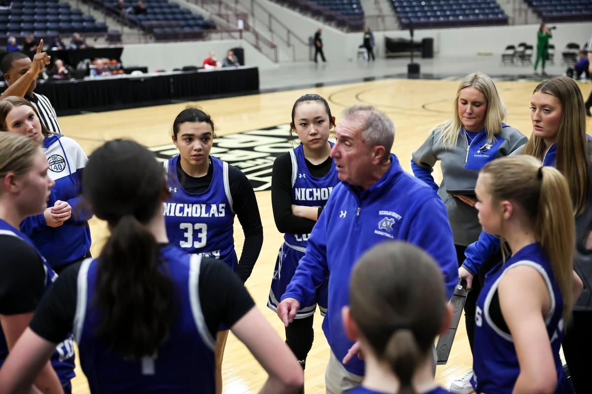 Nicholas County coach Greg Letcher talks with his team during a timeout at the All “A” Classic in Corbin last week. The Lady Jackets qualified for the small-school state tournament for the fifth time in program history and the first time since 2018.