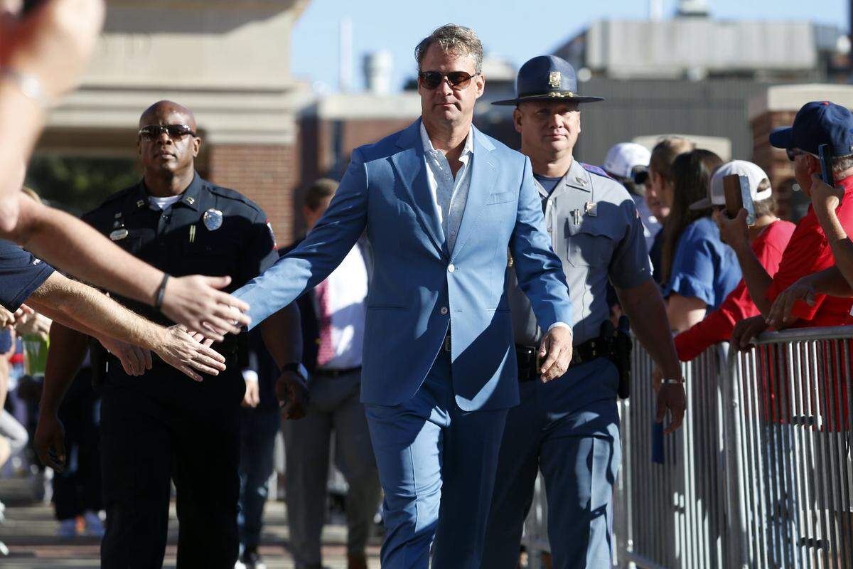 Oct 1, 2022; Oxford, Mississippi, USA; Mississippi Rebels head coach Lane Kiffin greets fans as he walks down the Walk of Champions prior to game against the Kentucky Wildcats at Vaught-Hemingway Stadium. Mandatory Credit: Petre Thomas-USA TODAY Sports