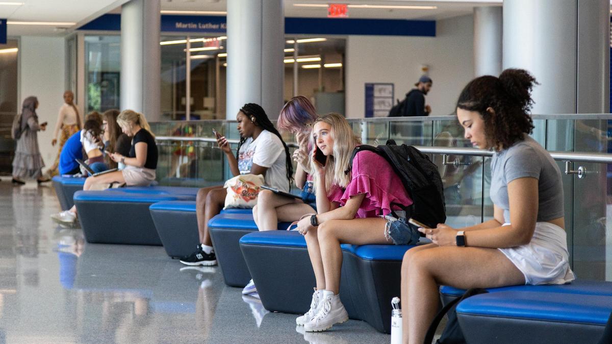 Students gather within several communal areas of UK’s Gatton Student Center between classes, August 21, 2023.