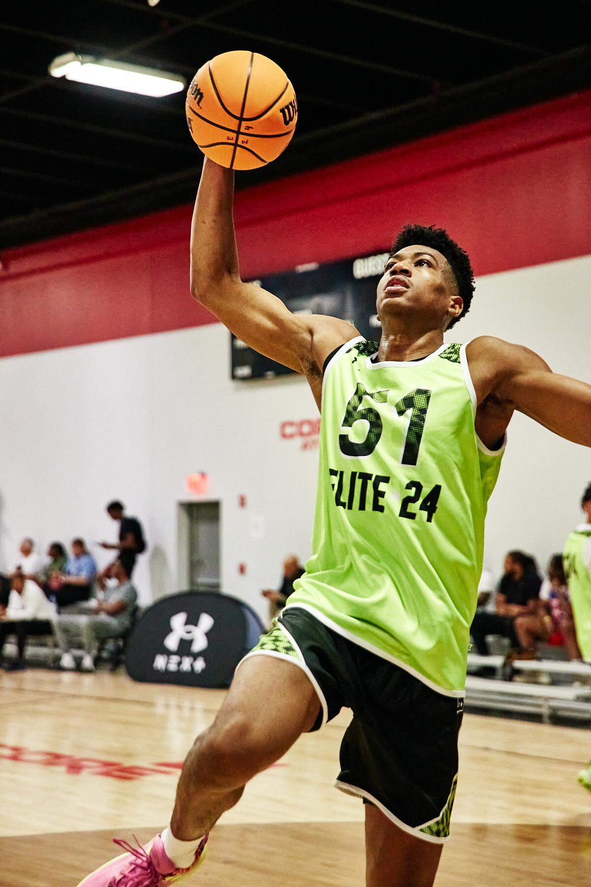 Class of 2025 college basketball recruit Bryson Tiller goes to dunk the ball during the Under Armour Next Elite 24 event in August 2023 at the CORE4 Atlanta facility in Chamblee, Georgia. Tiller has a long list of schools that have extended him a scholarship offer, but Kentucky hasn’t yet.