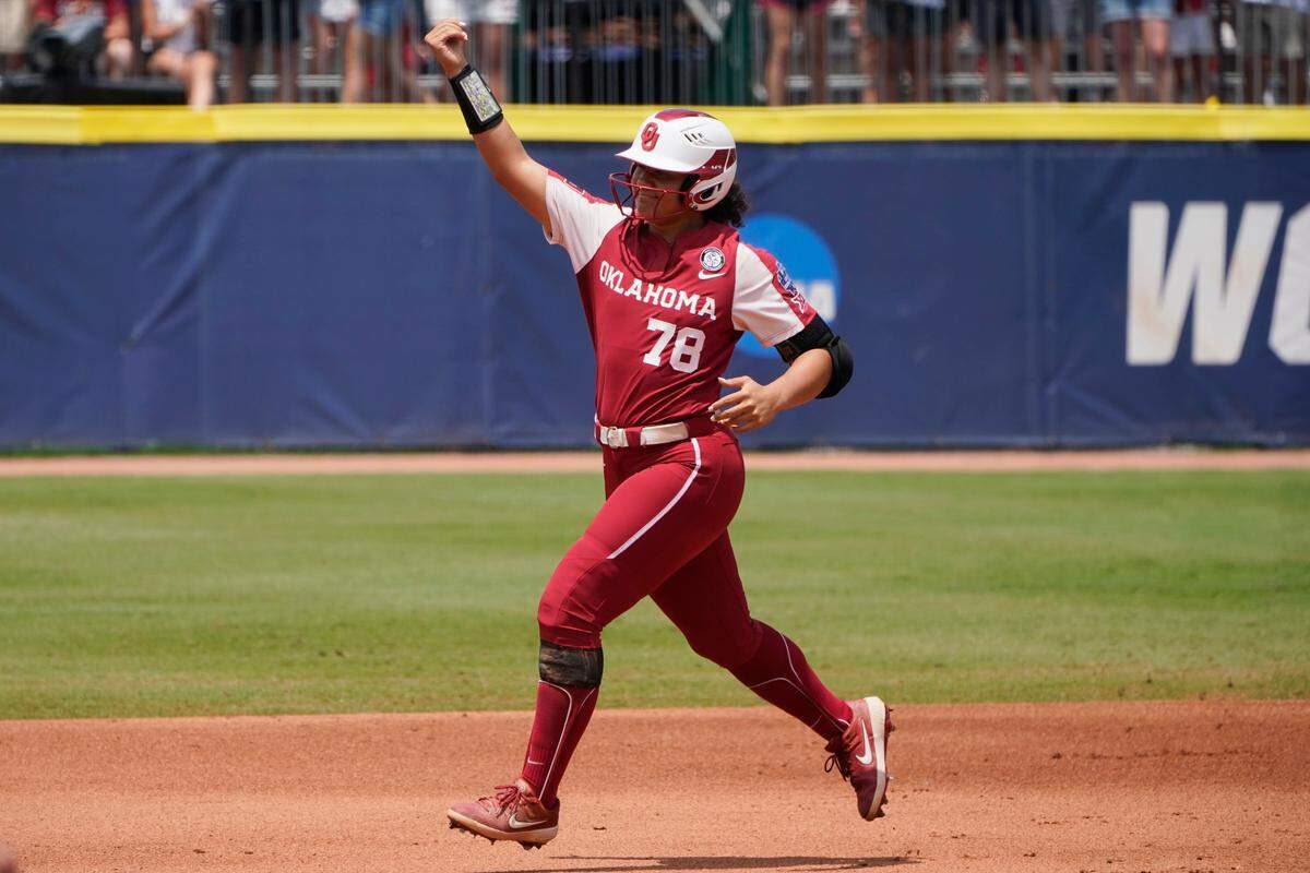 Oklahoma’s Jocelyn Alo (78) celebrates as she runs to home plate following her home run against Florida State in the first inning of the final game of the NCAA Women’s College World Series softball championship series Thursday, June 10, 2021, in Oklahoma City. (AP Photo/Sue Ogrocki)