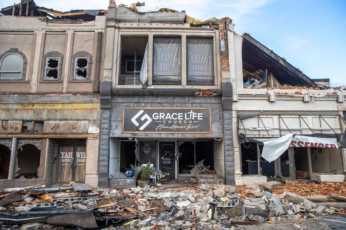 Buildings are demolished in downtown Mayfield, Ky., on Saturday, Dec. 11, 2021, after a tornado traveled through the region Friday night.