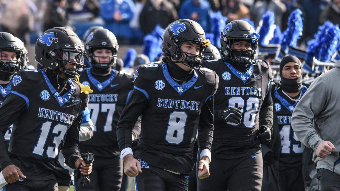 Kentucky quarterback Cutter Boley (8) takes the field against Louisville in his first start for the Wildcats.