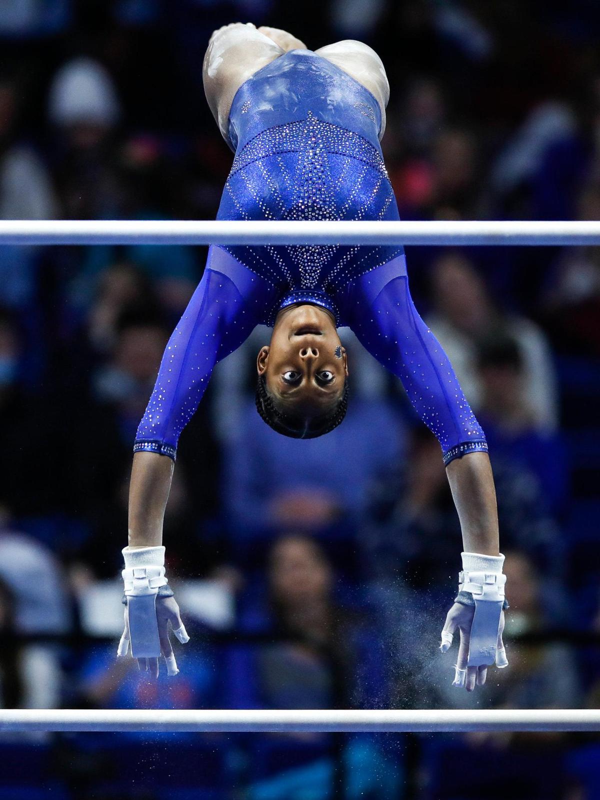Kentucky’s Cally Nixon performs on the uneven bars during the annual Excite Night meet at Rupp Arena in Lexington, Ky., Friday, January 14, 2022. Nixon, a senior, would go on to compete in the individual component of the 2022 NCAA Championships with two other Wildcats.