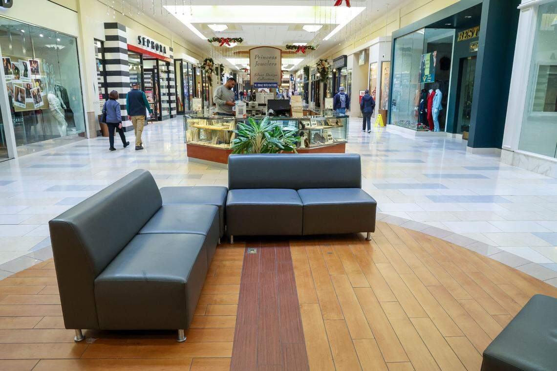 NOW: A staple of early mall construction, the recessed sitting area has been replaced with fewer couches and shopping kiosks. Photo taken Friday, Dec. 13, 2024 in Fayette Mall.
