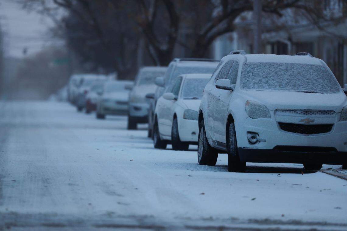 Snow covers parked cars in Lexington, Ky., as the city deals with an arctic front on Dec. 23, 2022. Temperatures plummeted nearly 40 degrees overnight.