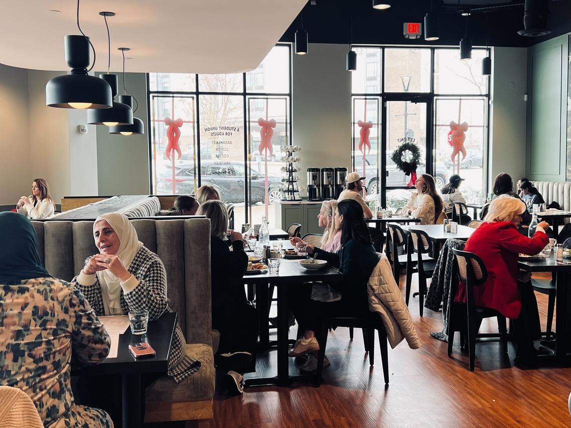 Customers escape the cold by grabbing a bite to eat and warm drinks at Cafe Patachou, located at Fritz Farm Dec. 8, 2025, in Lexington, Ky.