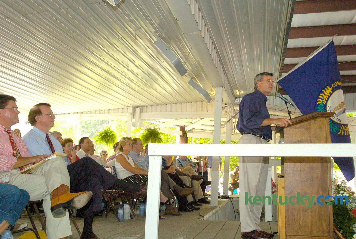 Kentucky Attorney General Greg Stumbo, left, and Kentucky House Speaker Jody Richards, listen as Gov. Ernie Fletcher spoke at the 2005 Fancy Farm picnic.
