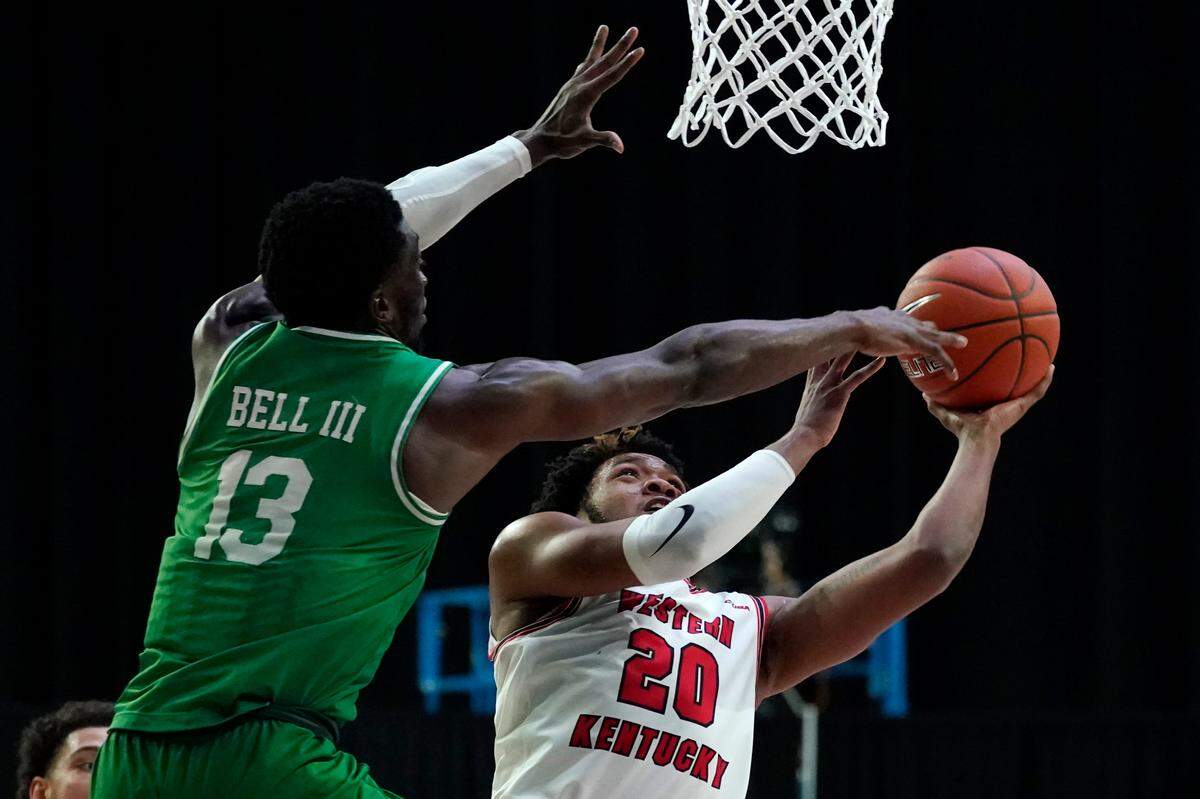 Western Kentucky guard Dayvion McKnight (20), Kentucky’s 2020 Mr. Basketball, will attempt to lead the Hilltoppers to their first NCAA Tournament appearance since 2013.