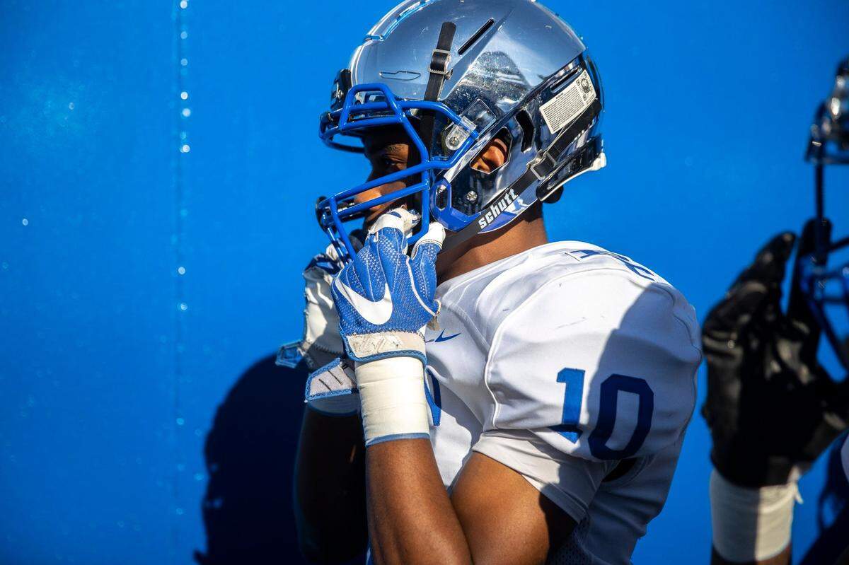 Paducah Tilghman’s Camdon Marshall listens to the national anthem before the Class 3A championship game at Kroger Field on Dec. 4.